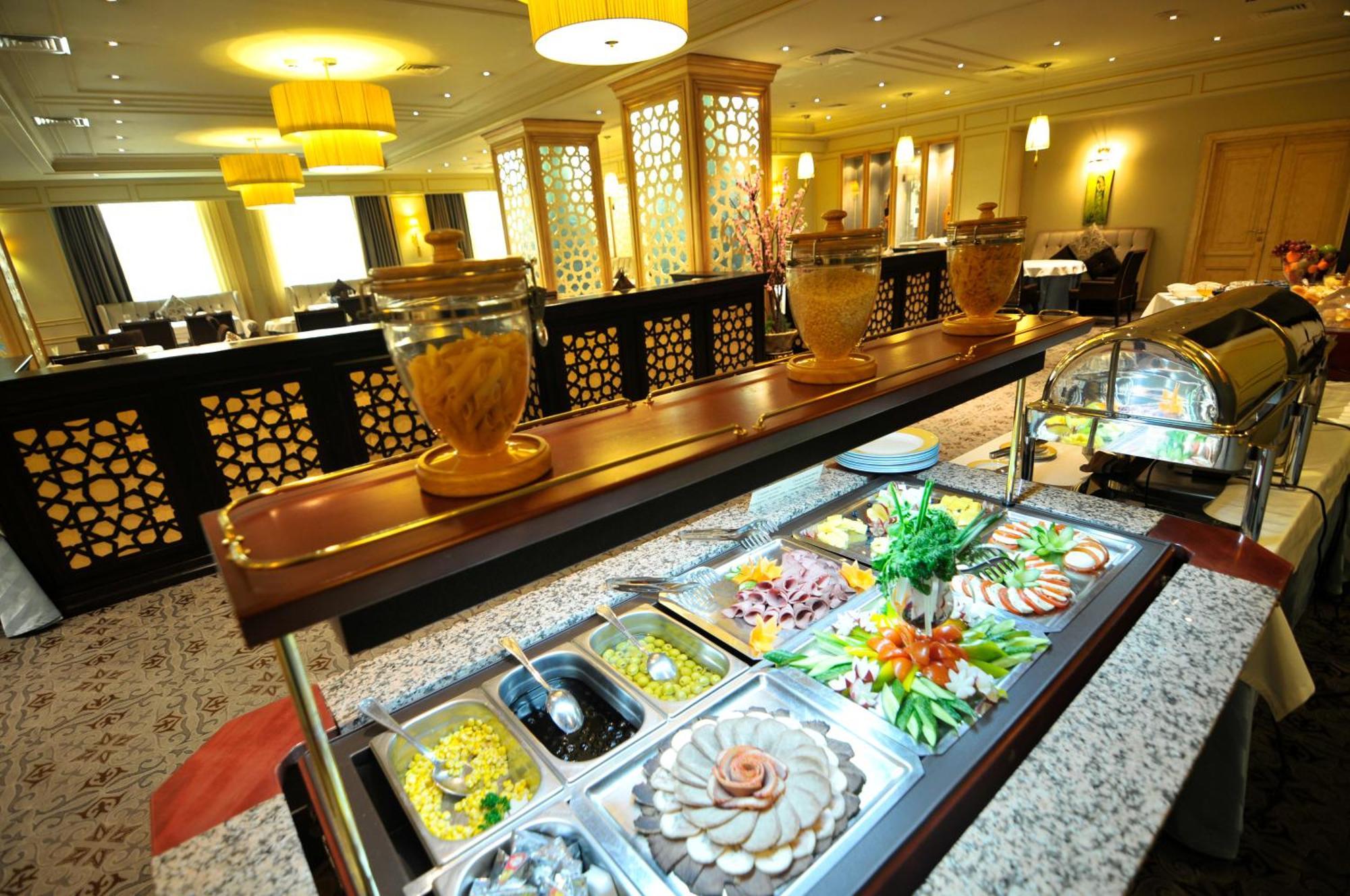 Grand Tien Shan Hotel อัลมาตี ร้านอาหาร รูปภาพ